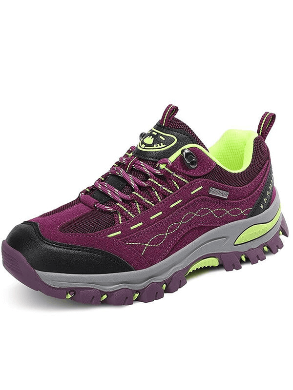Trekking women's sneakers, purple with black accents, designed for hiking comfort and durability with lace-up feature.